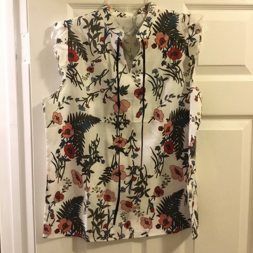 Large floral silky blouse with ties.